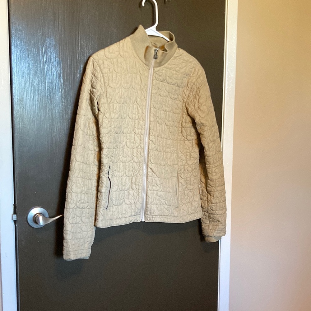 Beige burton snowboarding snow jacket